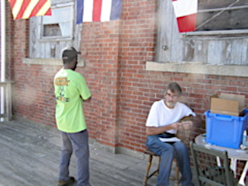 Two men lounging outdoors.